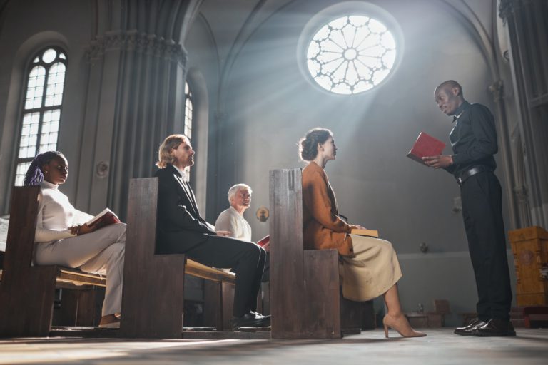 Priest reading the Bible